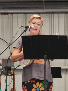 Tawni VanVleet performing in a mini-concert at the 2023 Carnival
