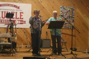 Tawni VanVleet and Cheryl Laimon performing at the 2022 Carnival open mic