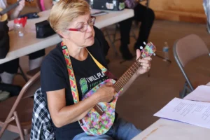 Tawni VanVleet with her custom Bonanza ukulele at the 2021 Carnival